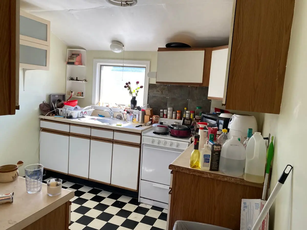 Selling a parent’s house after a move to care in Baldwin: dated kitchen with a black and white checkered floor