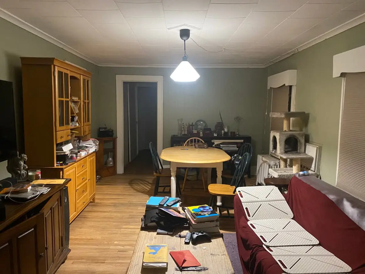 Selling a house during a divorce in Baldwin: dining area crowded with furniture and boxes